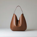 Riva Hobo tote bag in caramel/light brown.